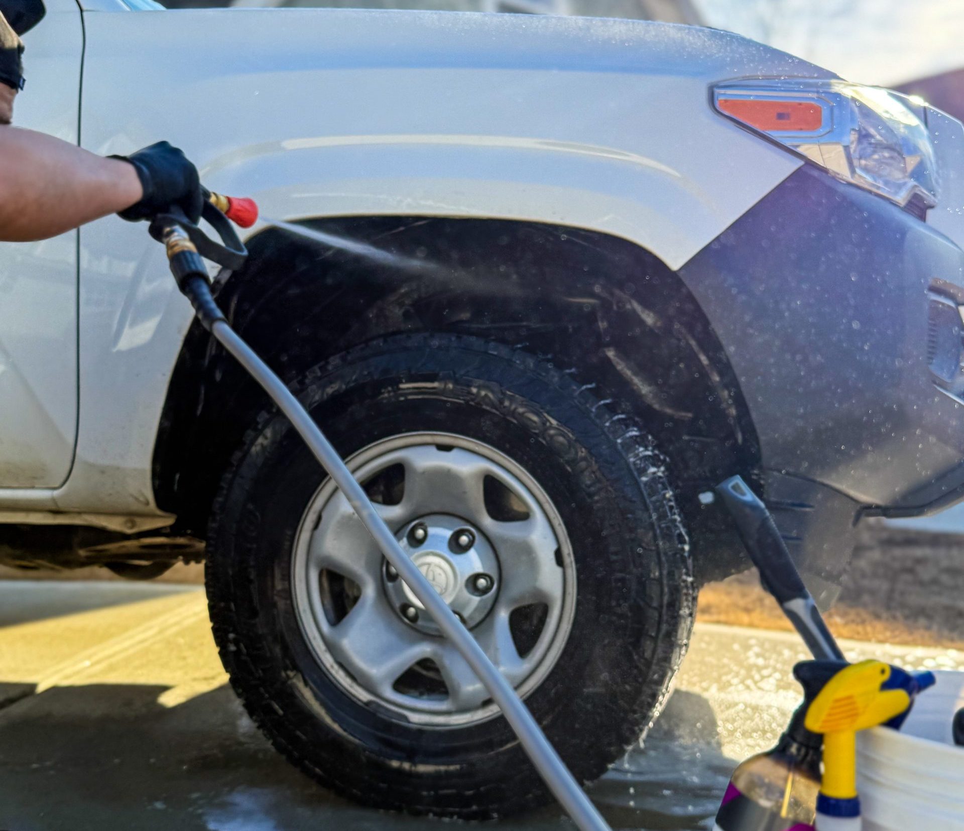 Mobile car detailing service by STO Detail washing a car in Peachtree City.