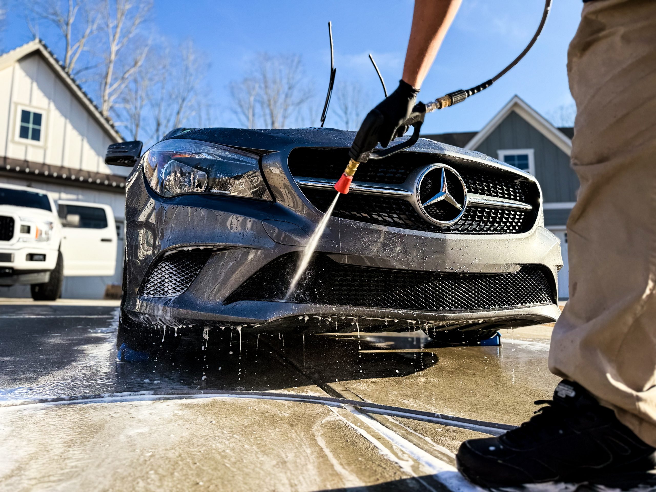 STO Detail technician performing a mobile car wash on a Mercedes-Benz CLA in Tyron, GA.